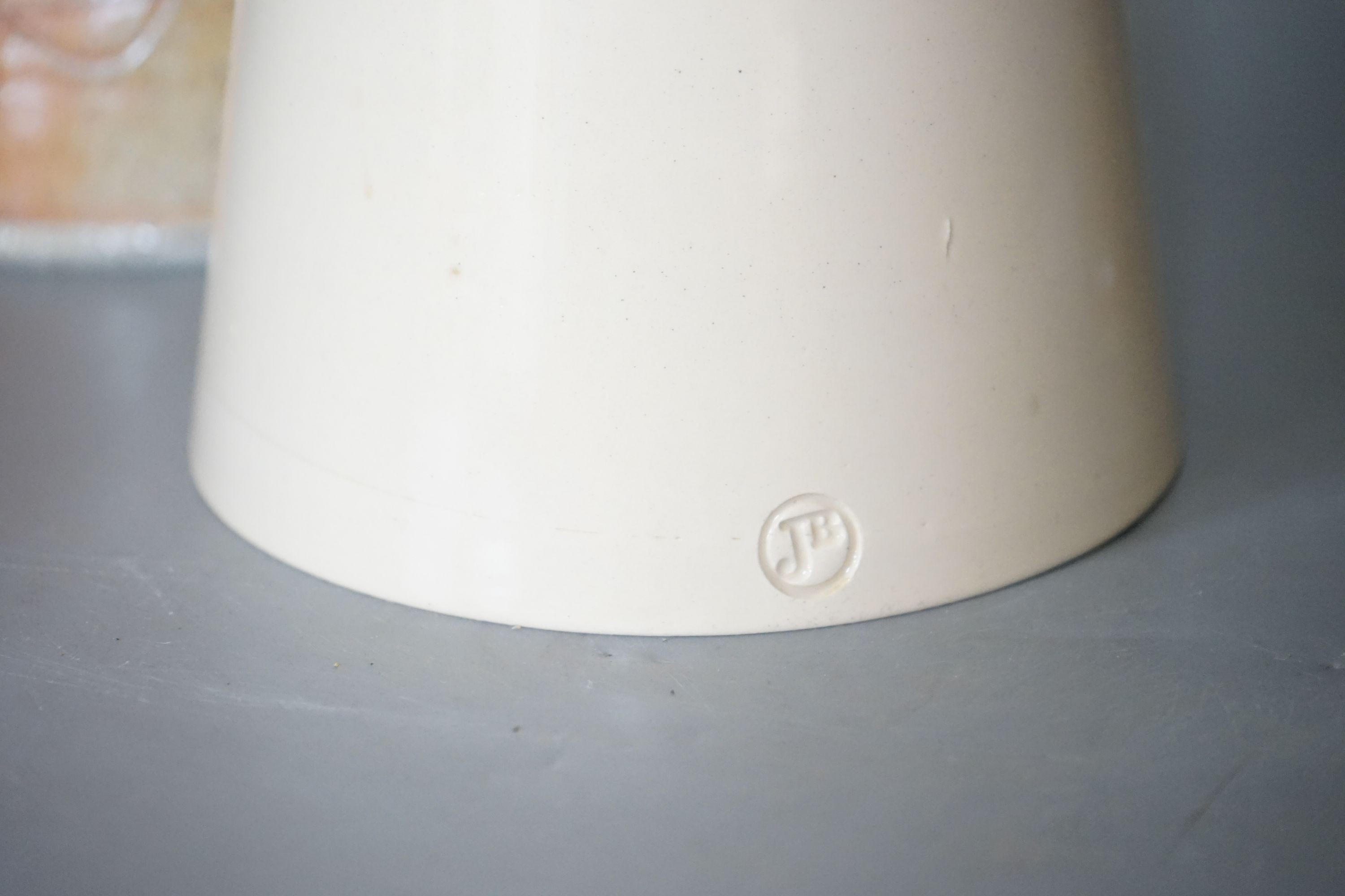 Studio pottery - a Duncan Beattie large stoneware jug, a Trevor Chaplin stoneware lidded jar, an Andrew Mason ruby and silver lustre vase and two Julian Bellmont cream glazed items – a jug and a similar bowl 33cm